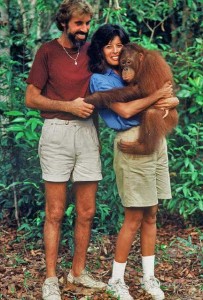 Evelyn & David with a young orangutan in Borneo
